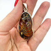 Carved Amber Free Shape Pendant Sterling Silver